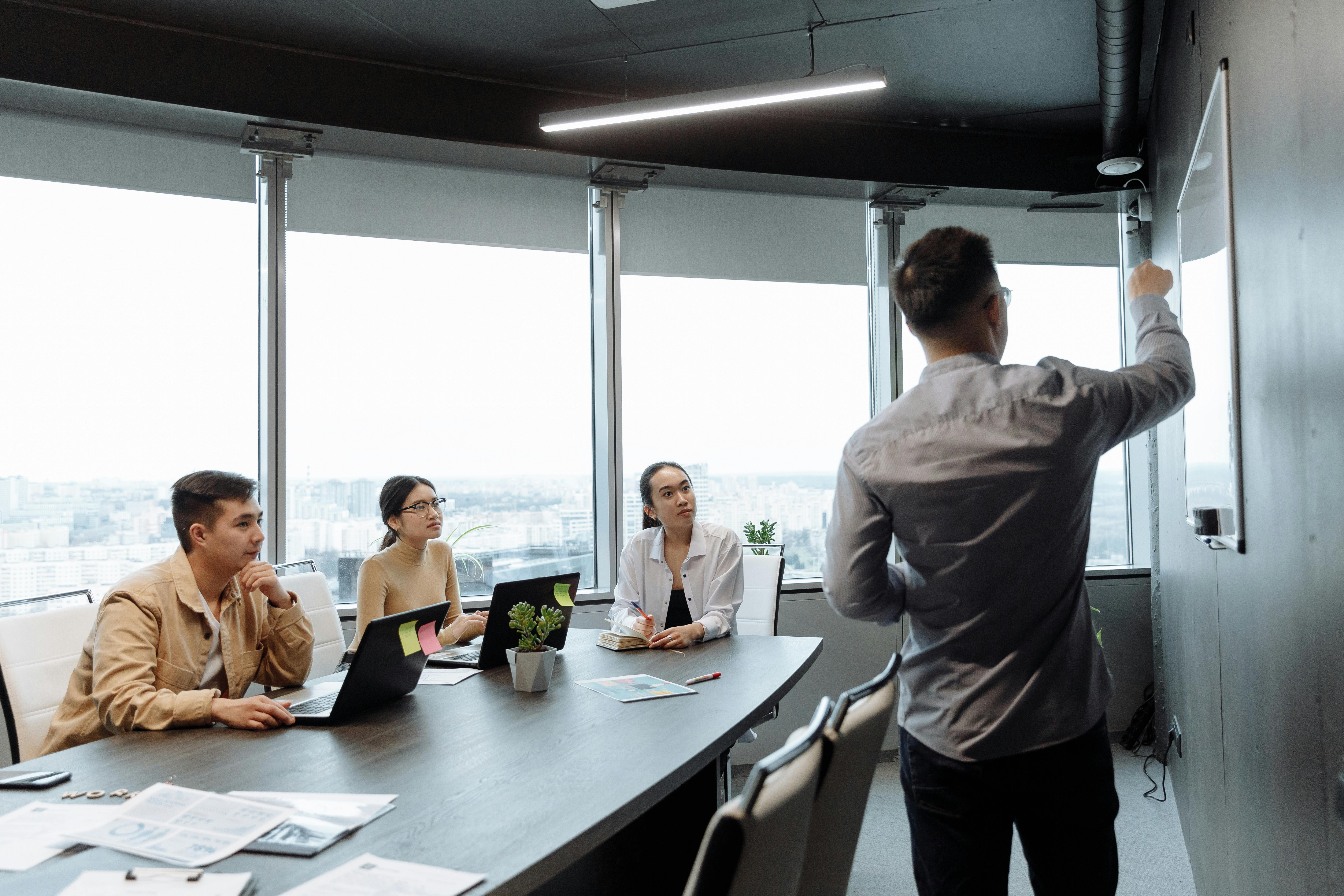 Sales team reviewing analytics and presentation data in a business meeting